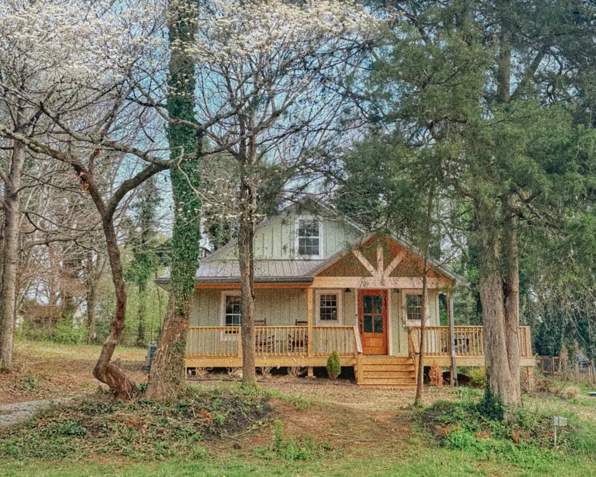 The cottage in early spring, blossom around the porch